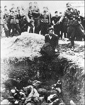 Nazi execution at edge of burial pit.